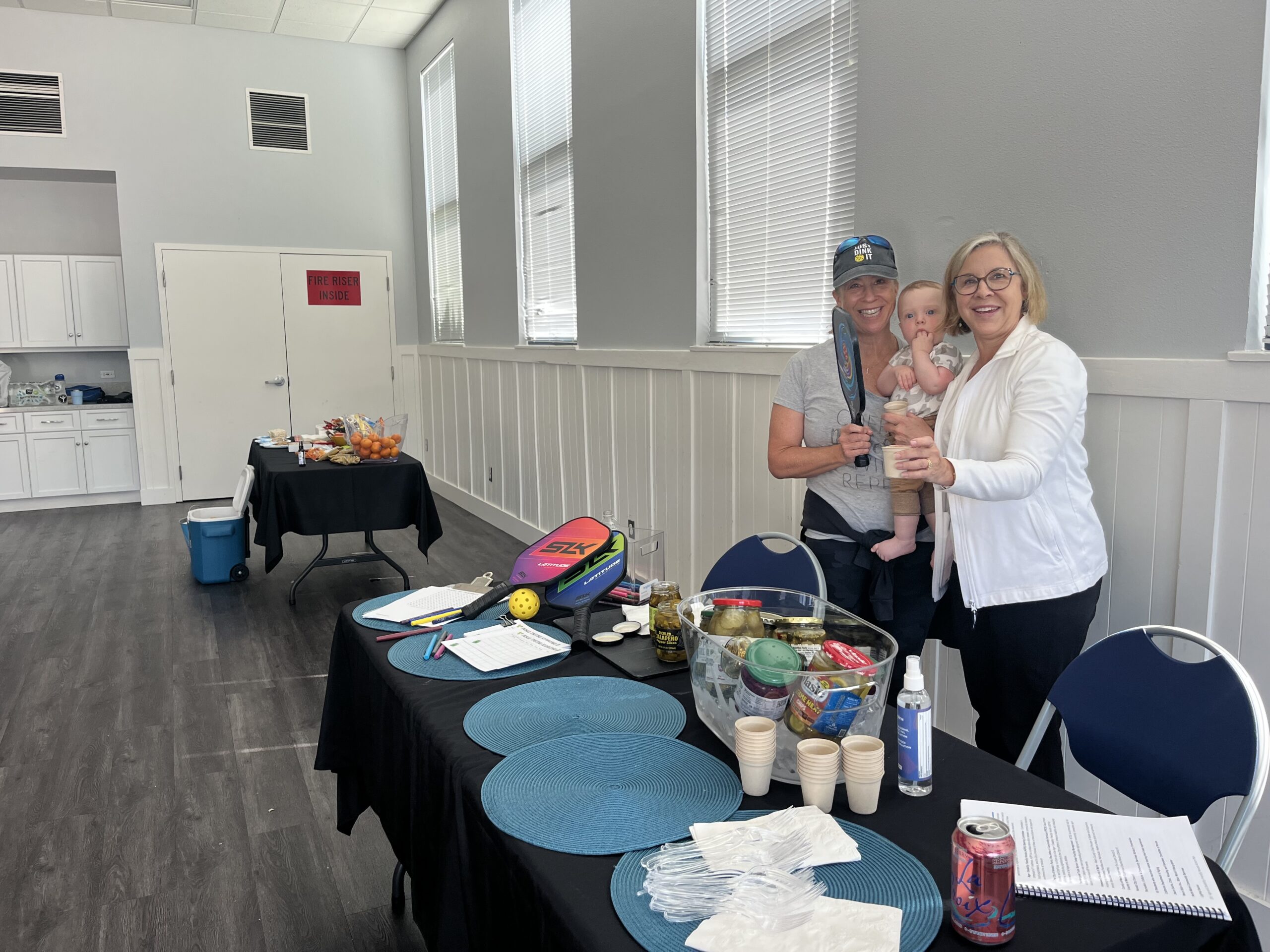 Two women with baby at ADFN table